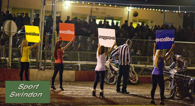 Swindon take 7 points to Poole. Speedway final first leg.Startline girls with Excalibur boards