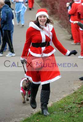 Hannah Golding Miss Swindon finishes the Santa Run at Coate Water Swindon